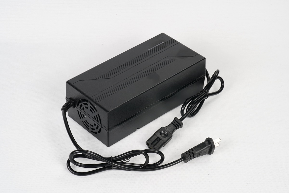 Black 48V lithium battery charger with power cable and DC output cable, matched to CATL LFP pack