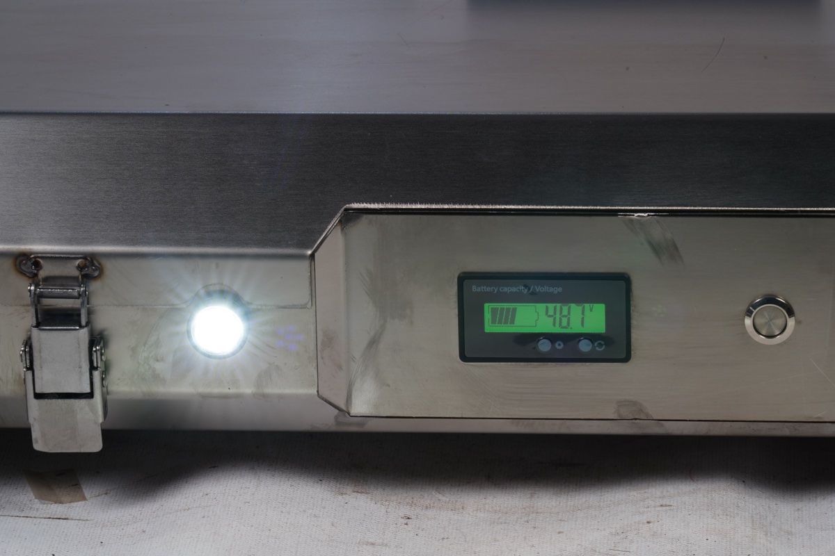 Battery voltage display showing 48.1V on the side of the electric tank carrier
